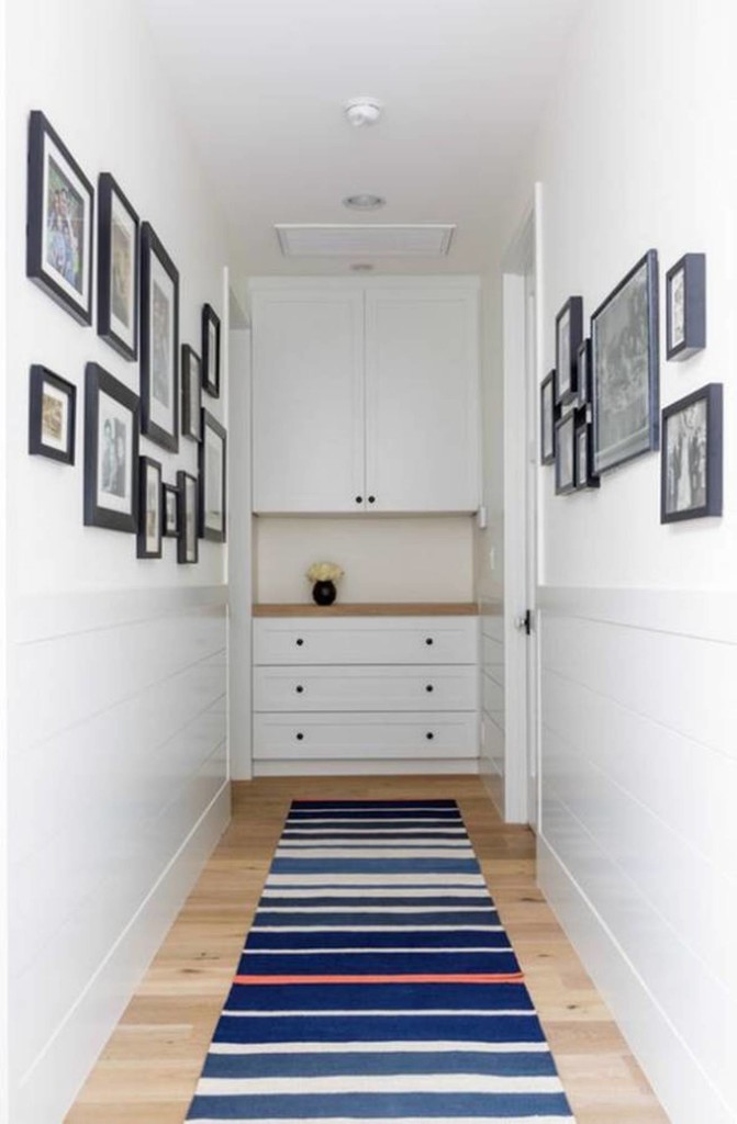 narrow-hallway-decorating-ideas-with-framed-wall-photos-and-striped-runner